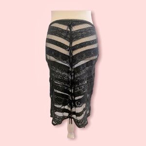 Sexy, sleek, sheer black pencil skirt with lace and bow accents. 33 inch waist.